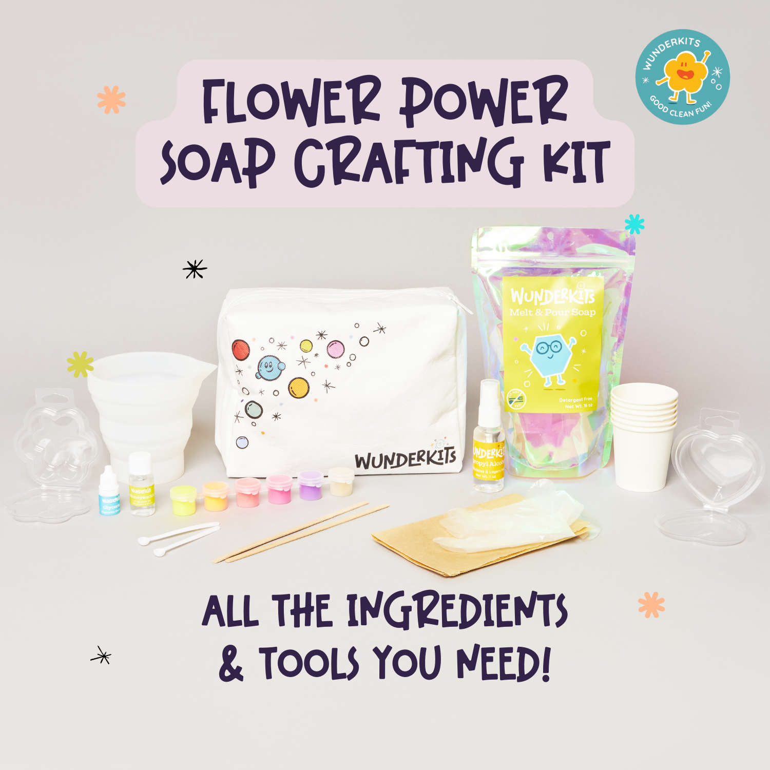 Flower power soap crafting kit with tools and ingredients on a light gray background