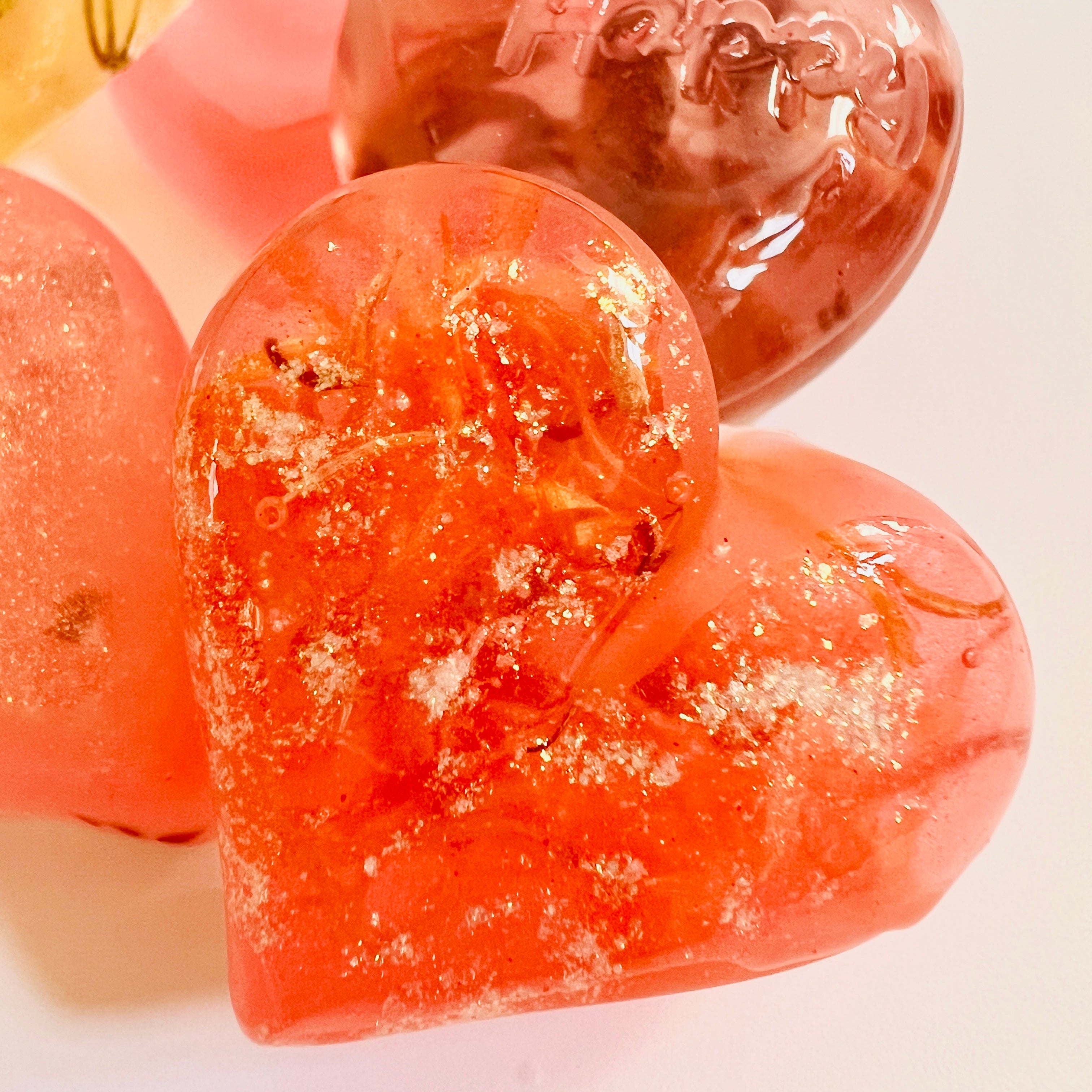 Heart-shaped soap with 'Happy' text on a light background